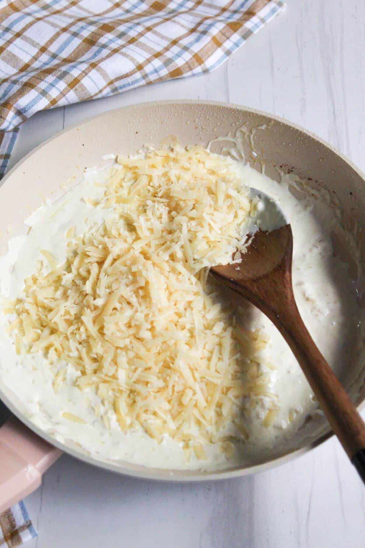 Parmesan added to skillet.