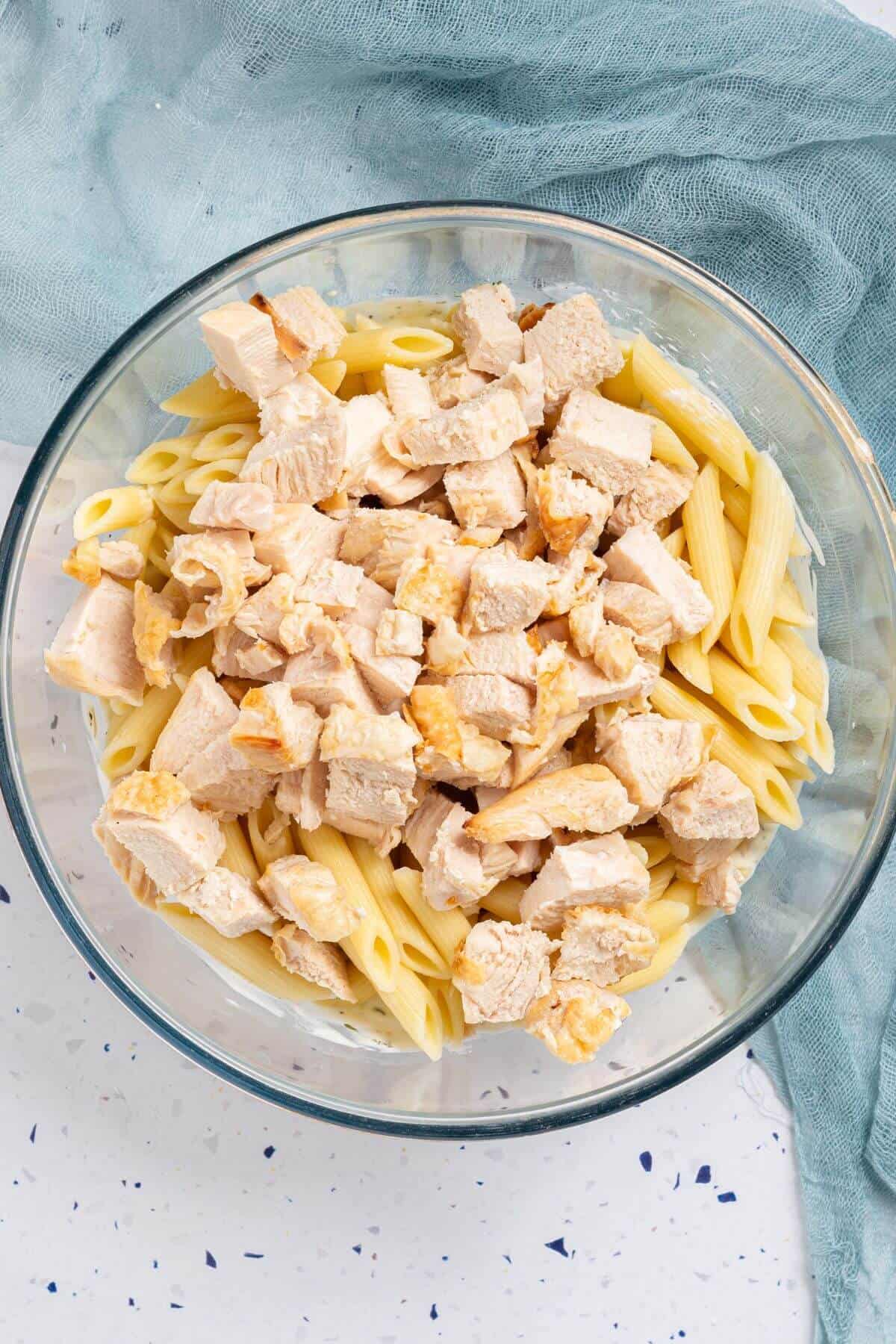 Pasta and chicken added to sauce.