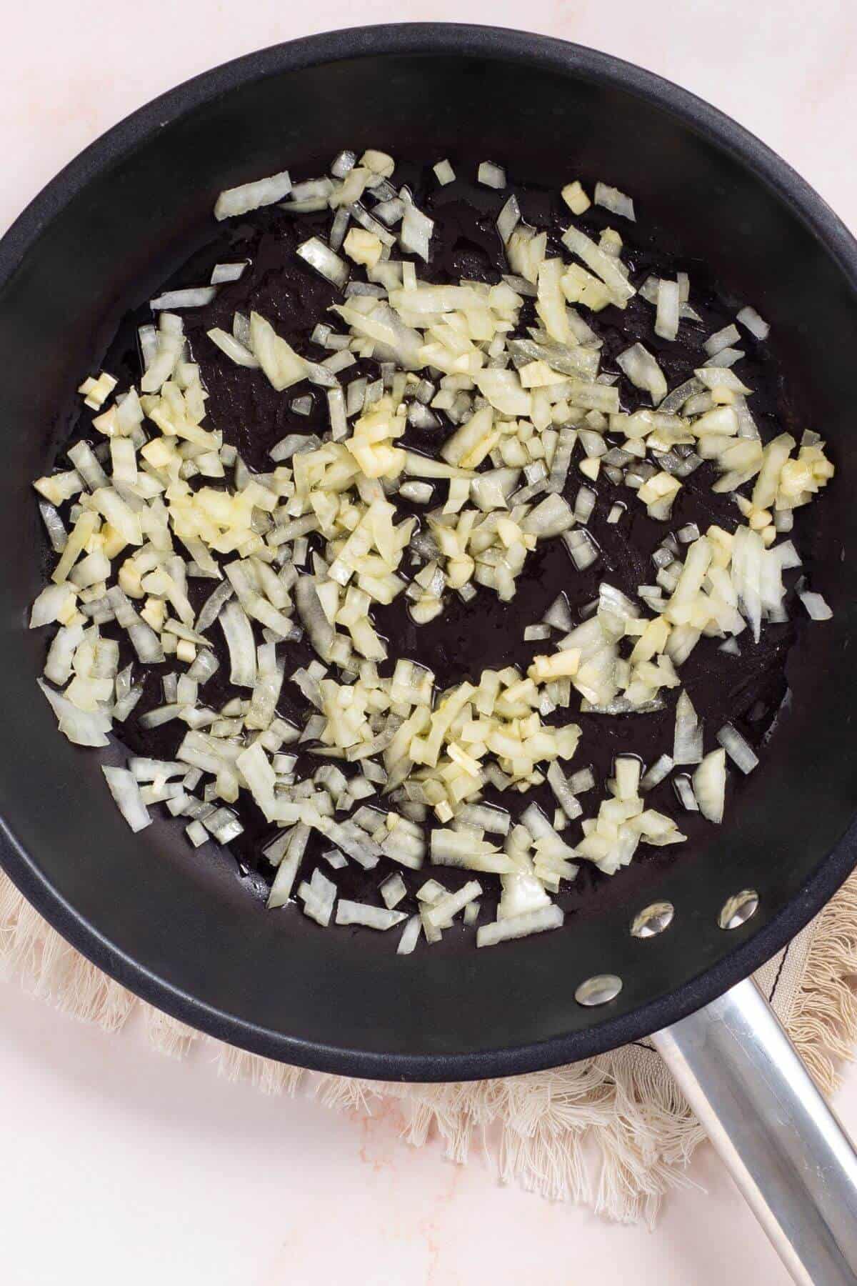 Sautéed onions and garlic in skillet.