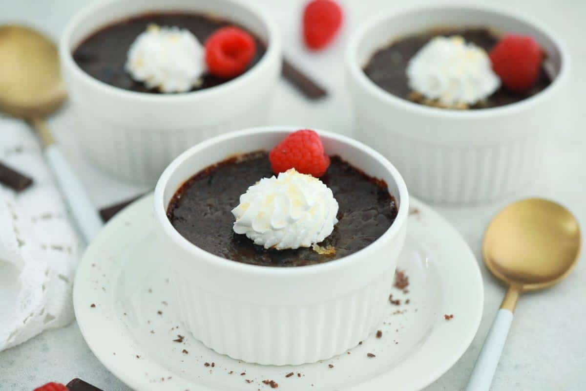 Chocolate creme brulee desserts in ramekins.