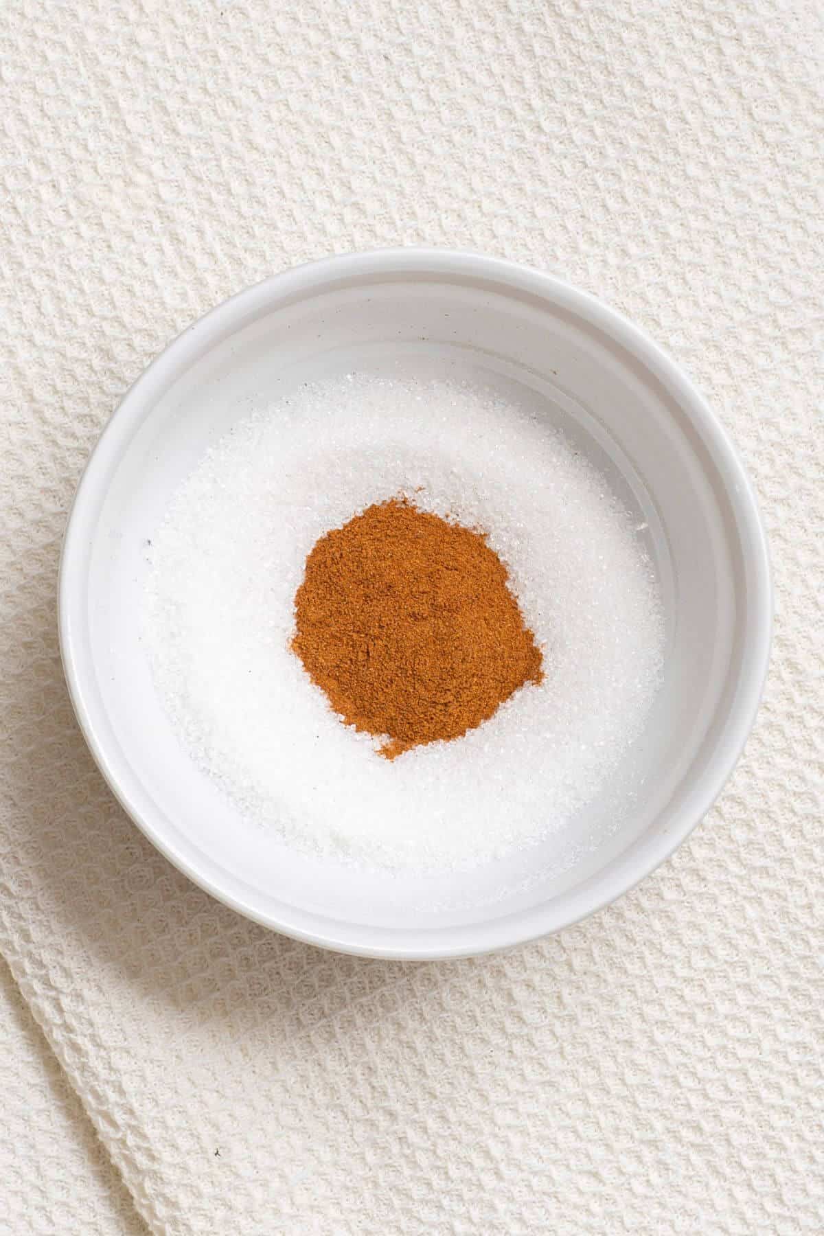 Sugar and cinnamon in a mixing bowl.