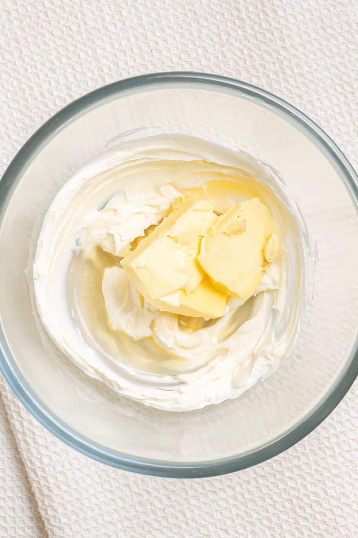 Butter and cream cheese in mixing bowl.