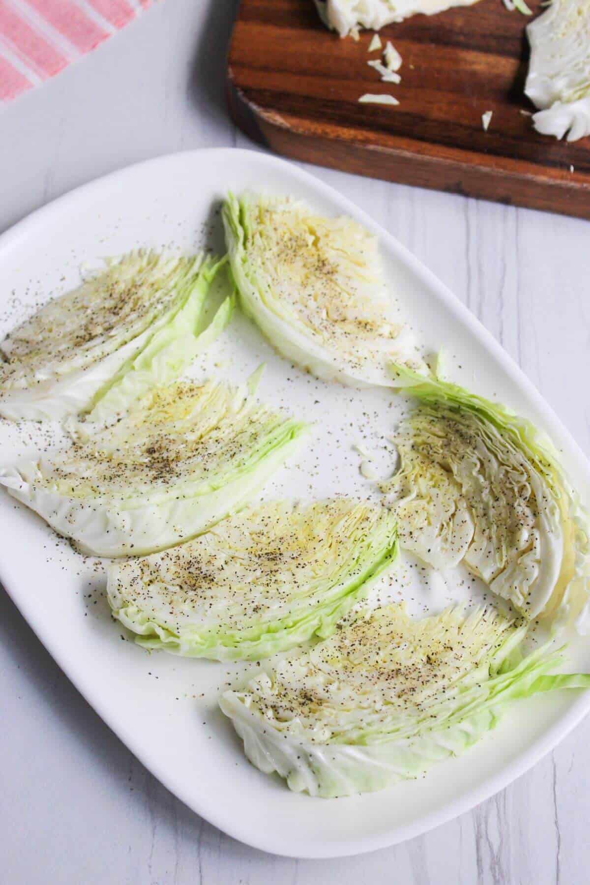 Cabbage wedges with oil and seasoning.