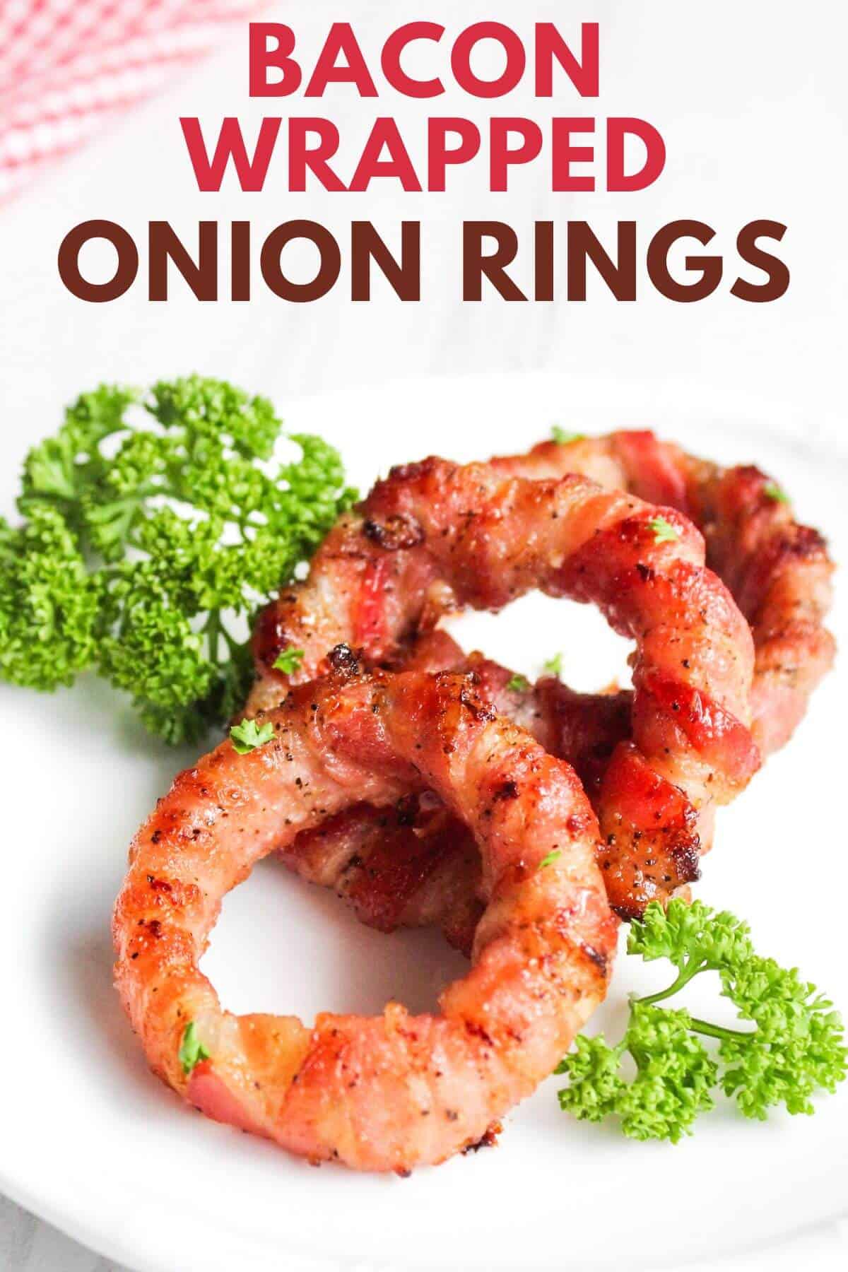 Bacon wrapped onion rings with text.