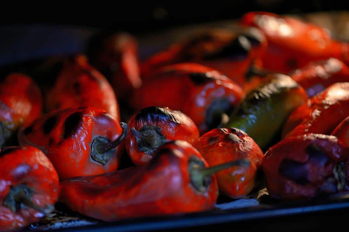 Roasting hot red peppers in oven.
