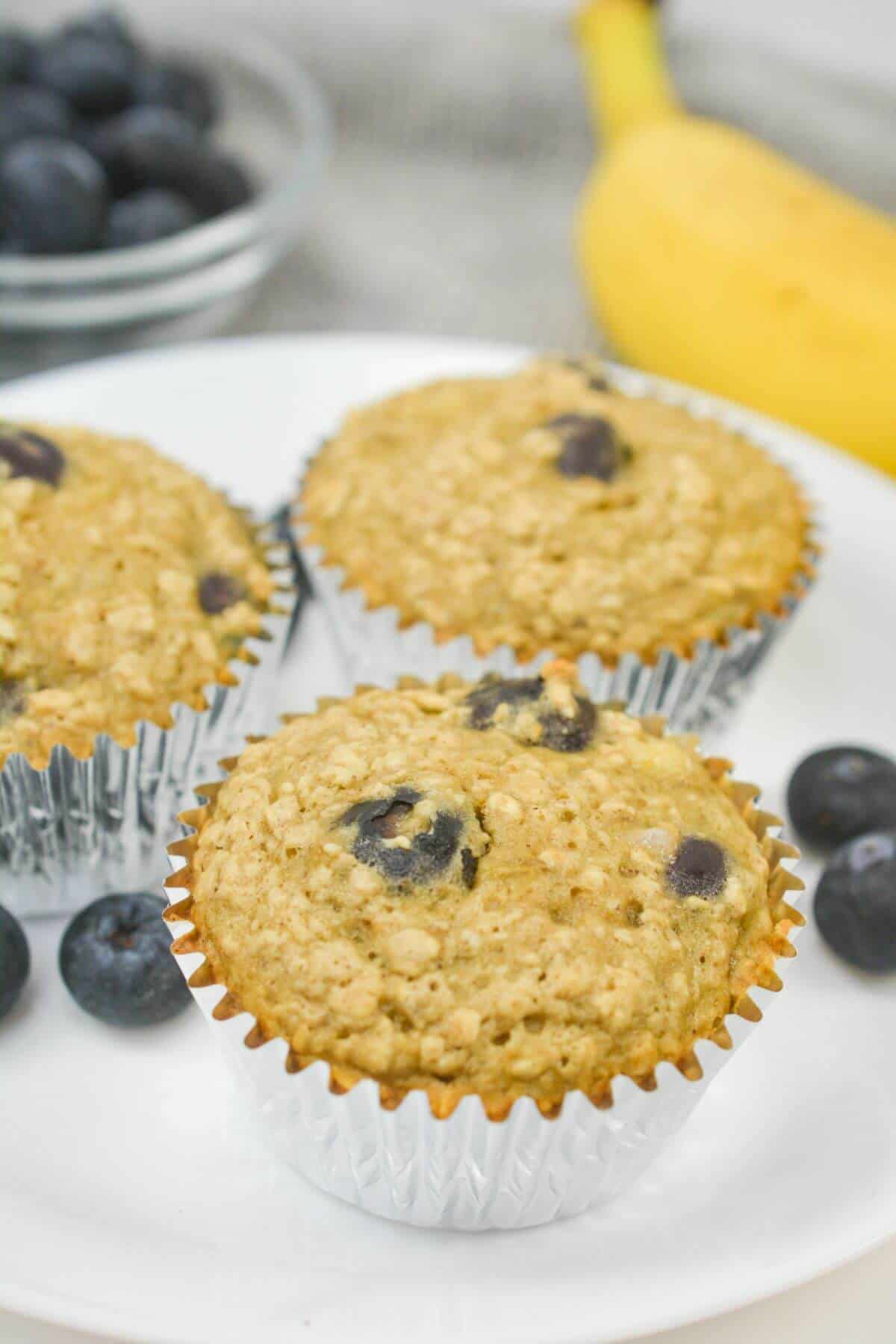 Oat blueberry muffins with fresh berries and bananas.