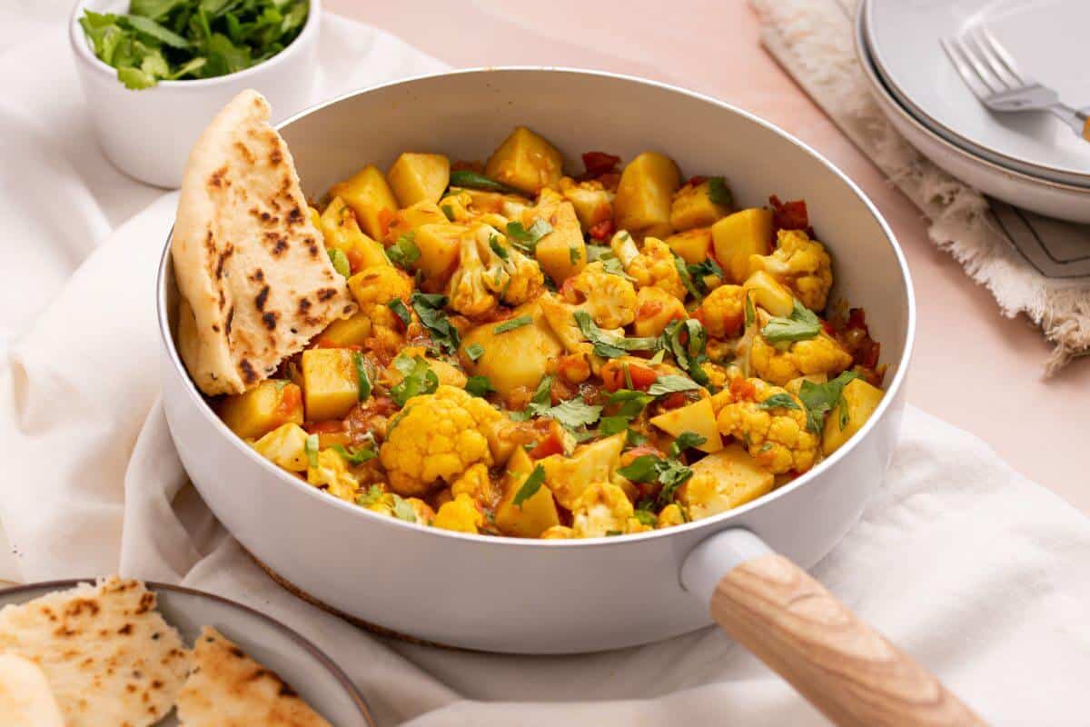 Aloo gobi masala in skillet.