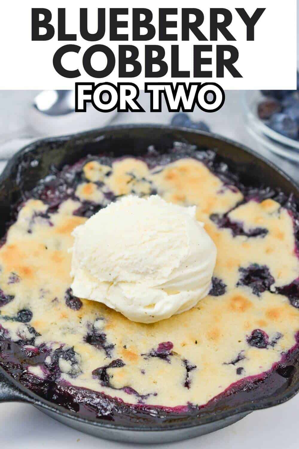 Blueberry cobbler for two with recipe title text overlay.