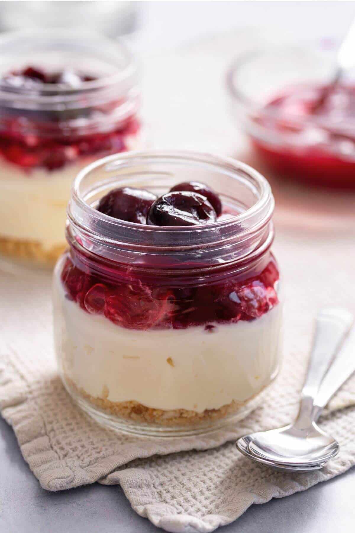 Cherry cheesecake in jars.