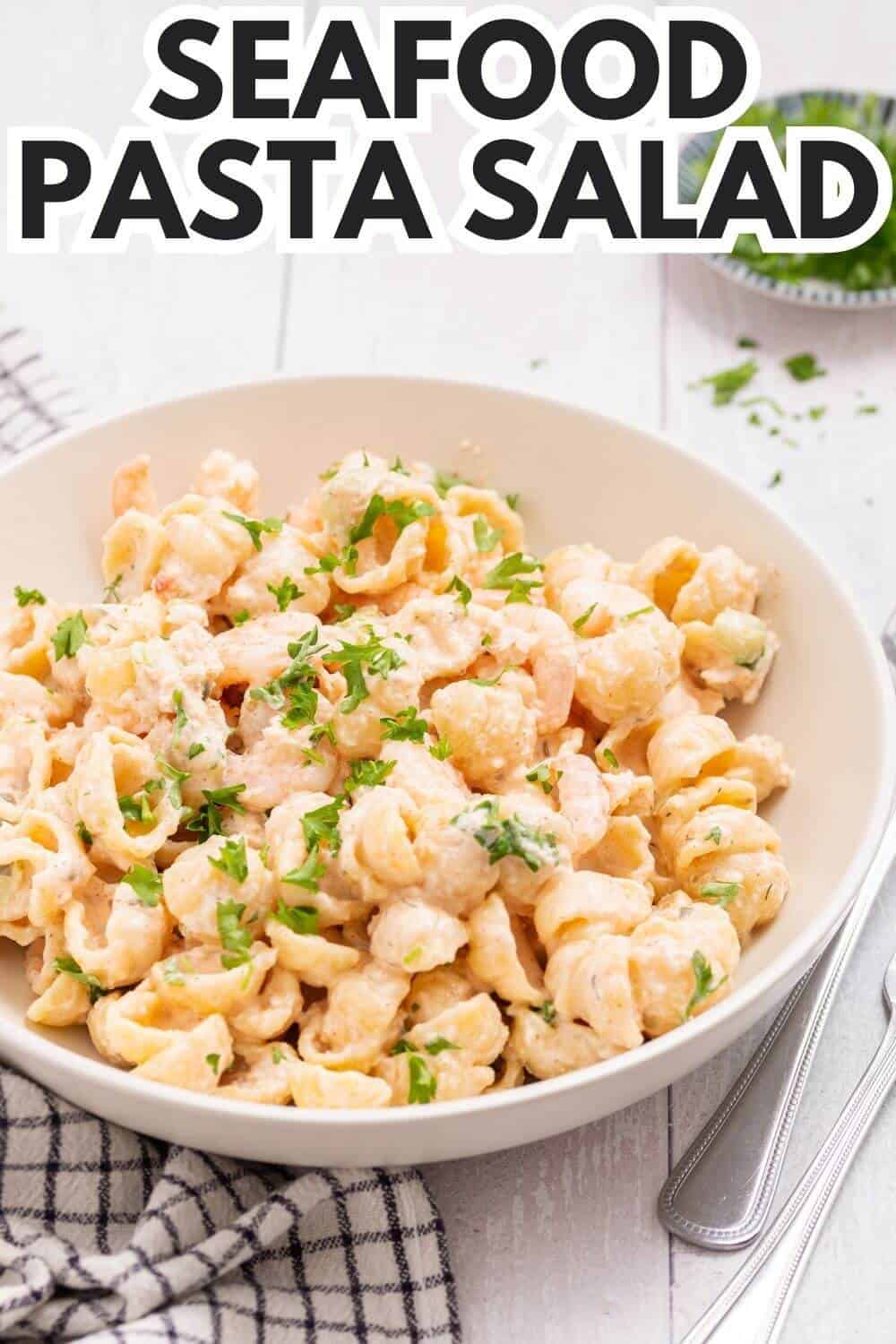Seafood pasta salad with recipe title text overlay.