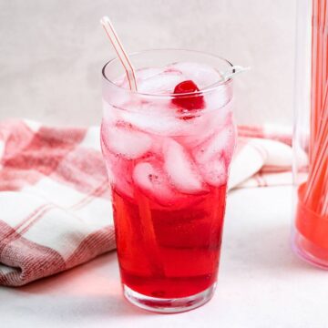 Shirley temple drink with straw.