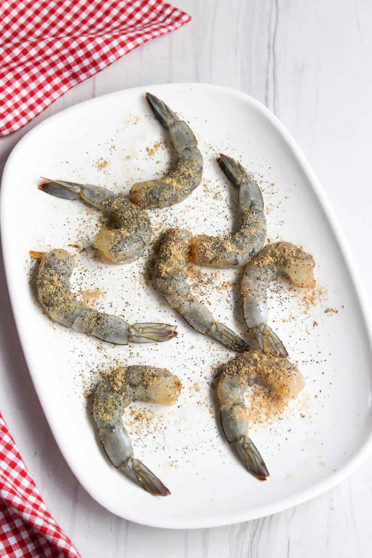 Seasoned shrimp on platter.