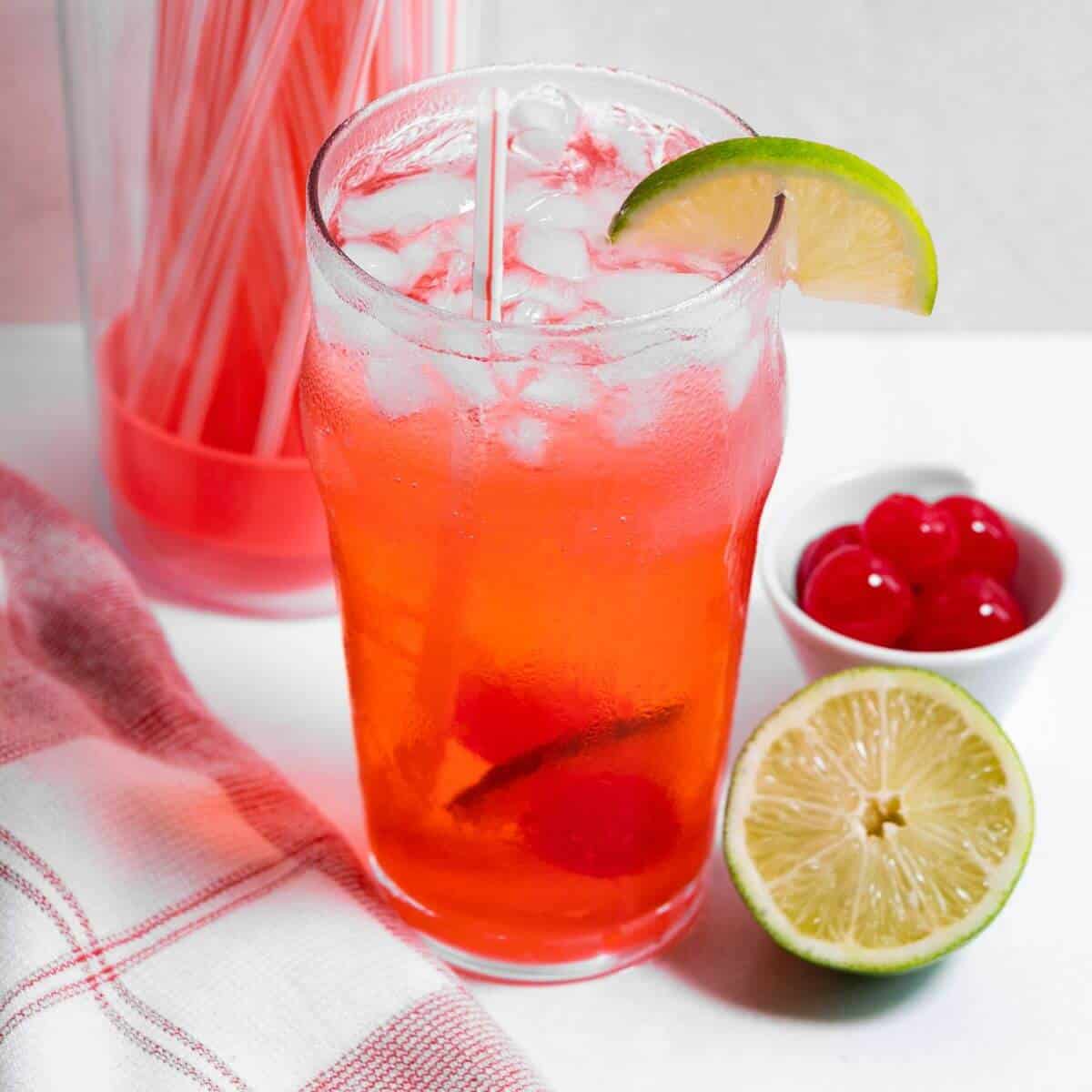 Top angled view of cherry limeade drink.
