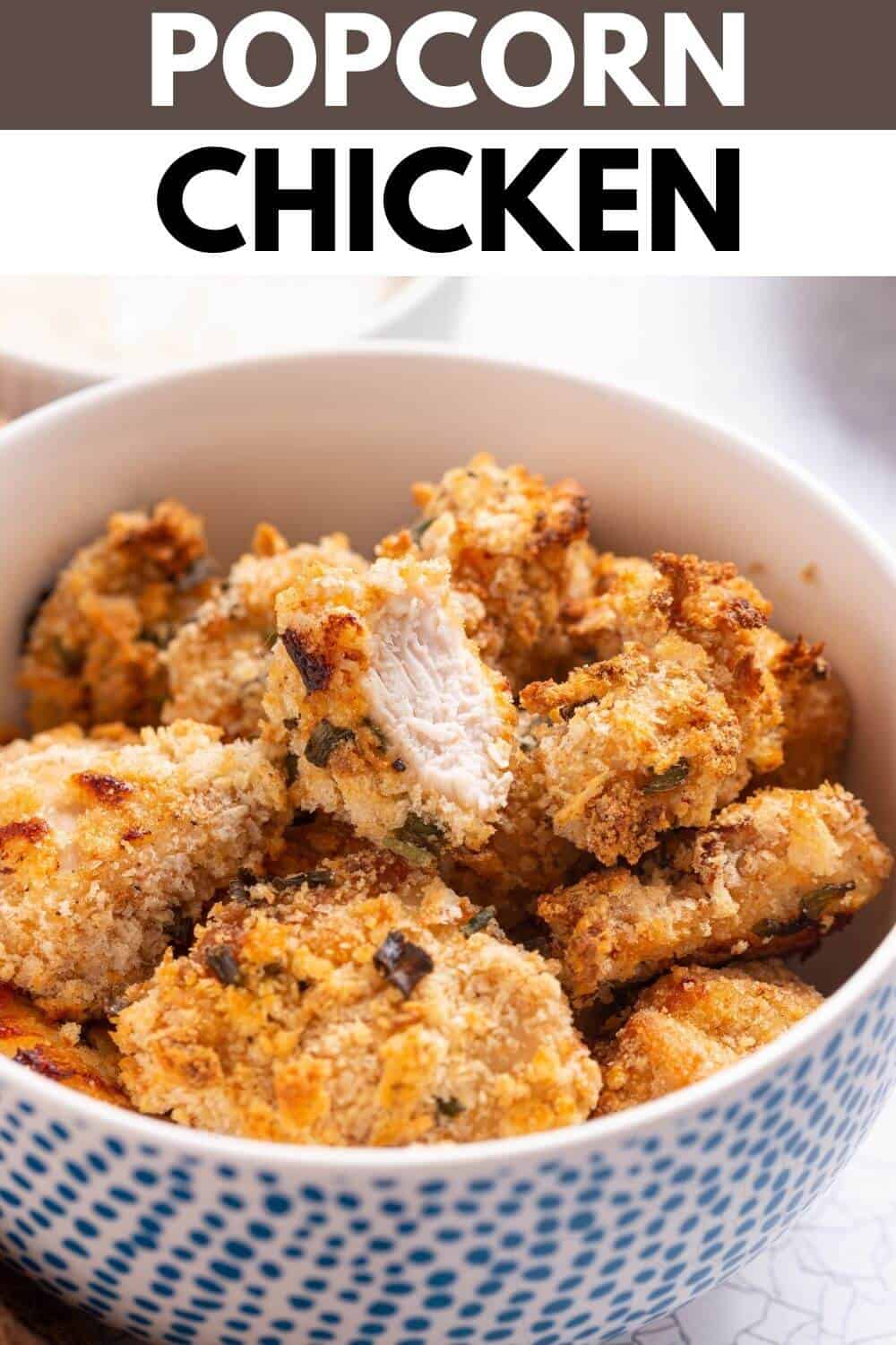 Popcorn chicken in bowl with title text overlay.