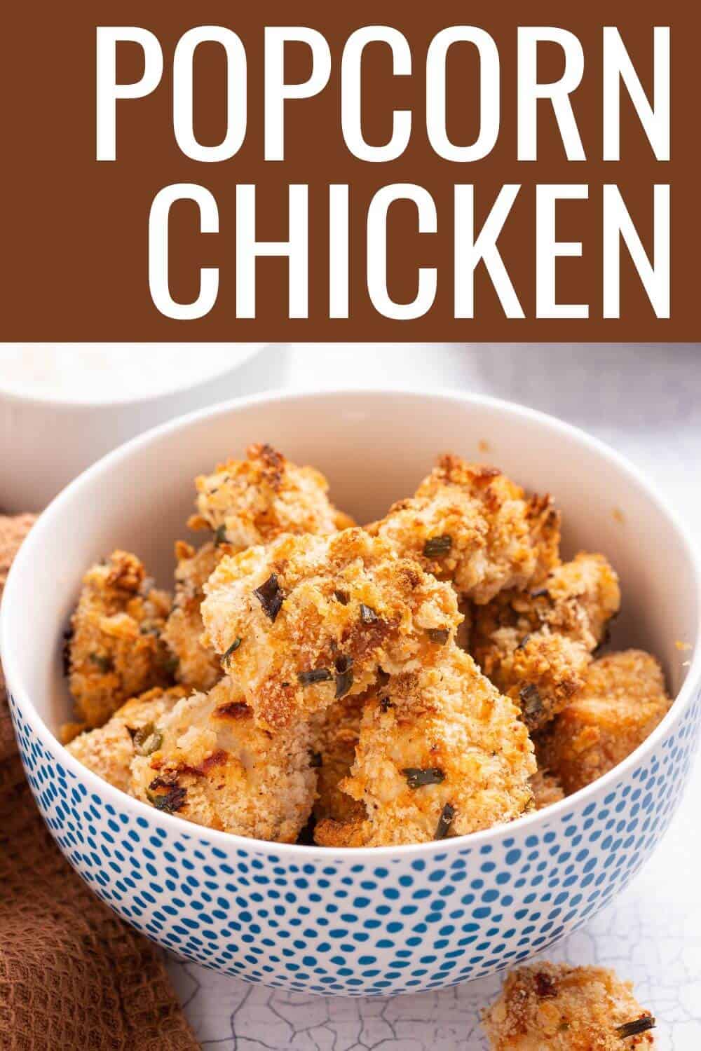 Popcorn chicken in bowl with title text overlay.