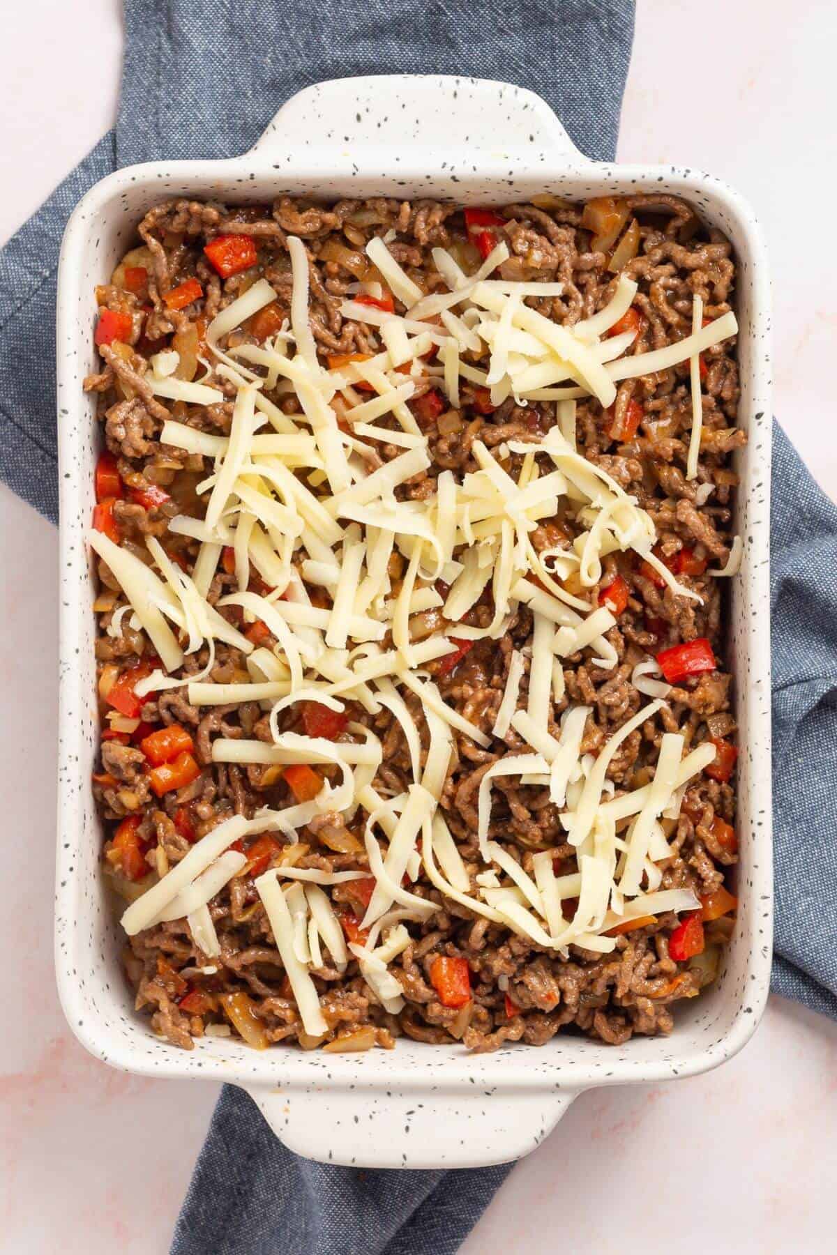 Ground beef mixture and cheese layer.