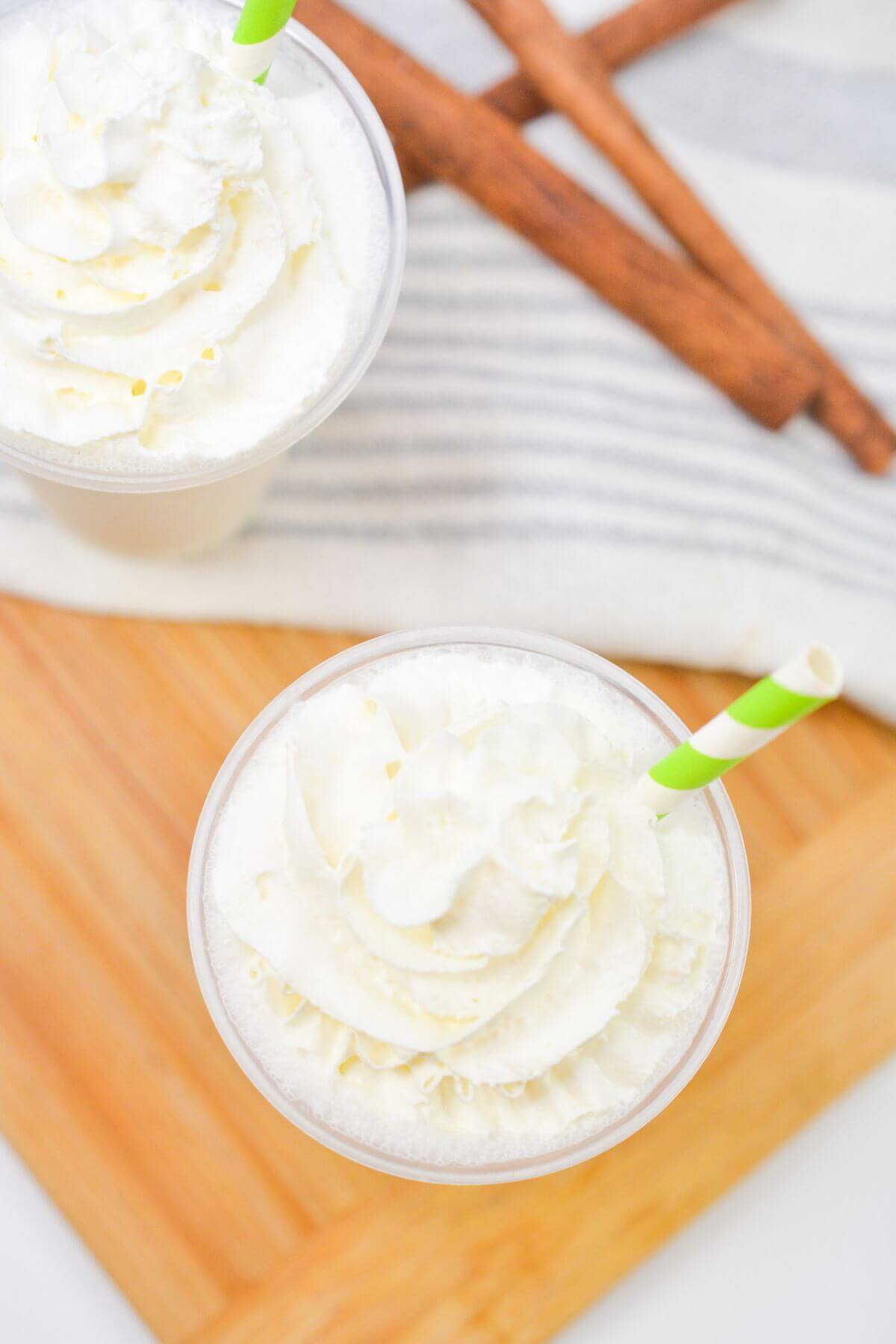 Whipped cream and straw added to the vanilla frappuccino.