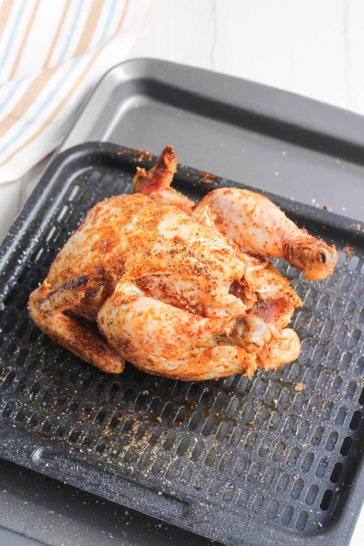 Cornish hen with golden skin after air frying.