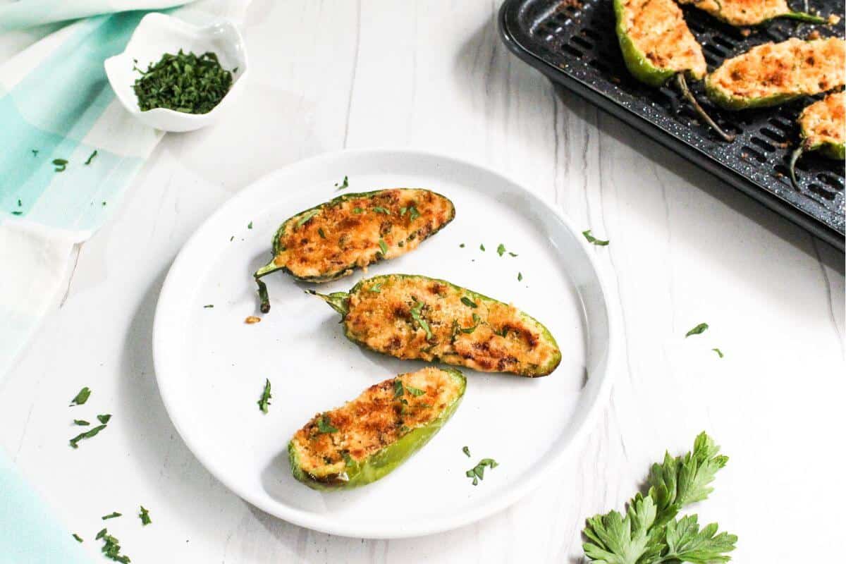 A plate of jalapeño poppers on a table.