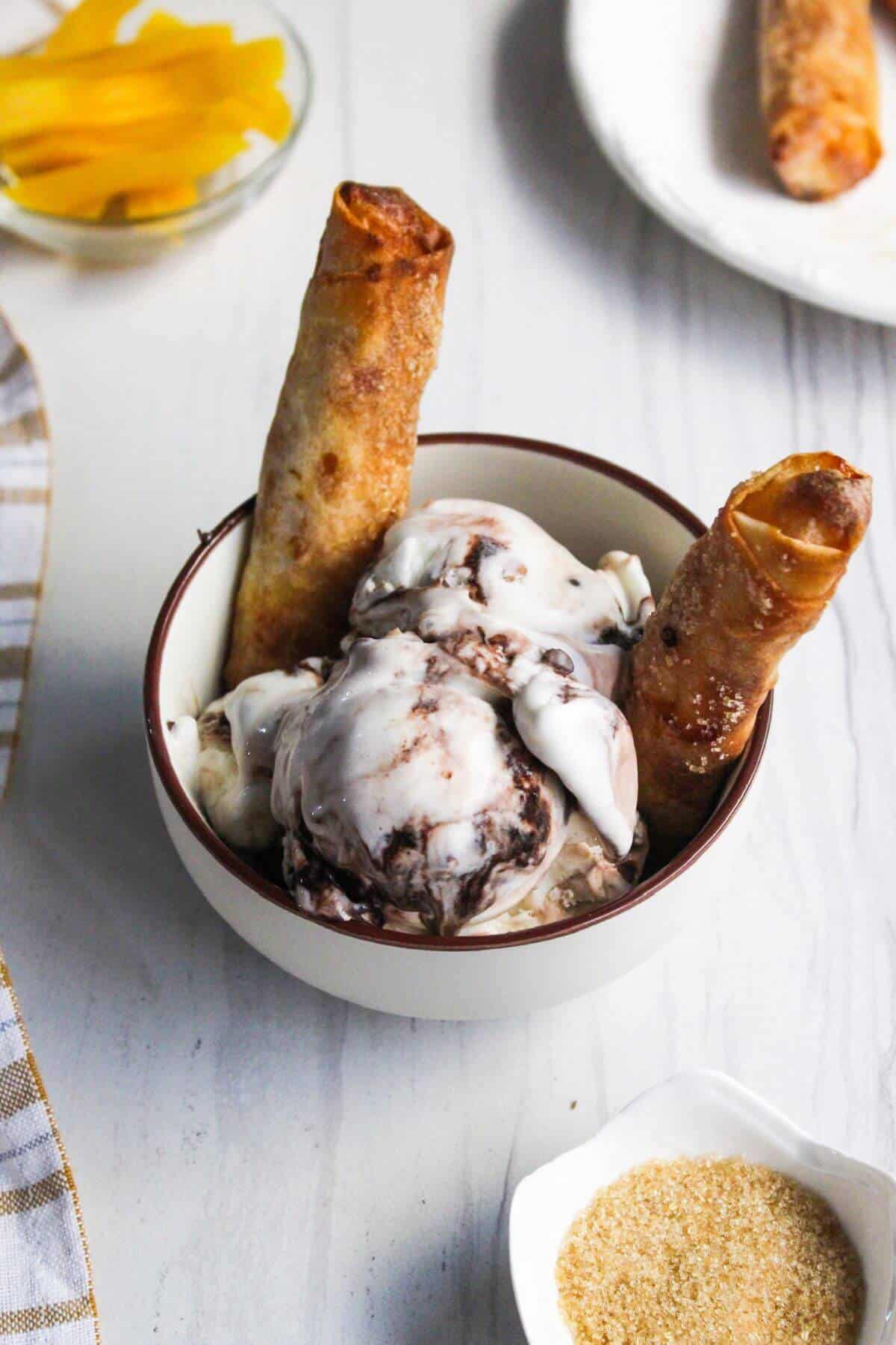 A bowl of ice cream with banana turon.