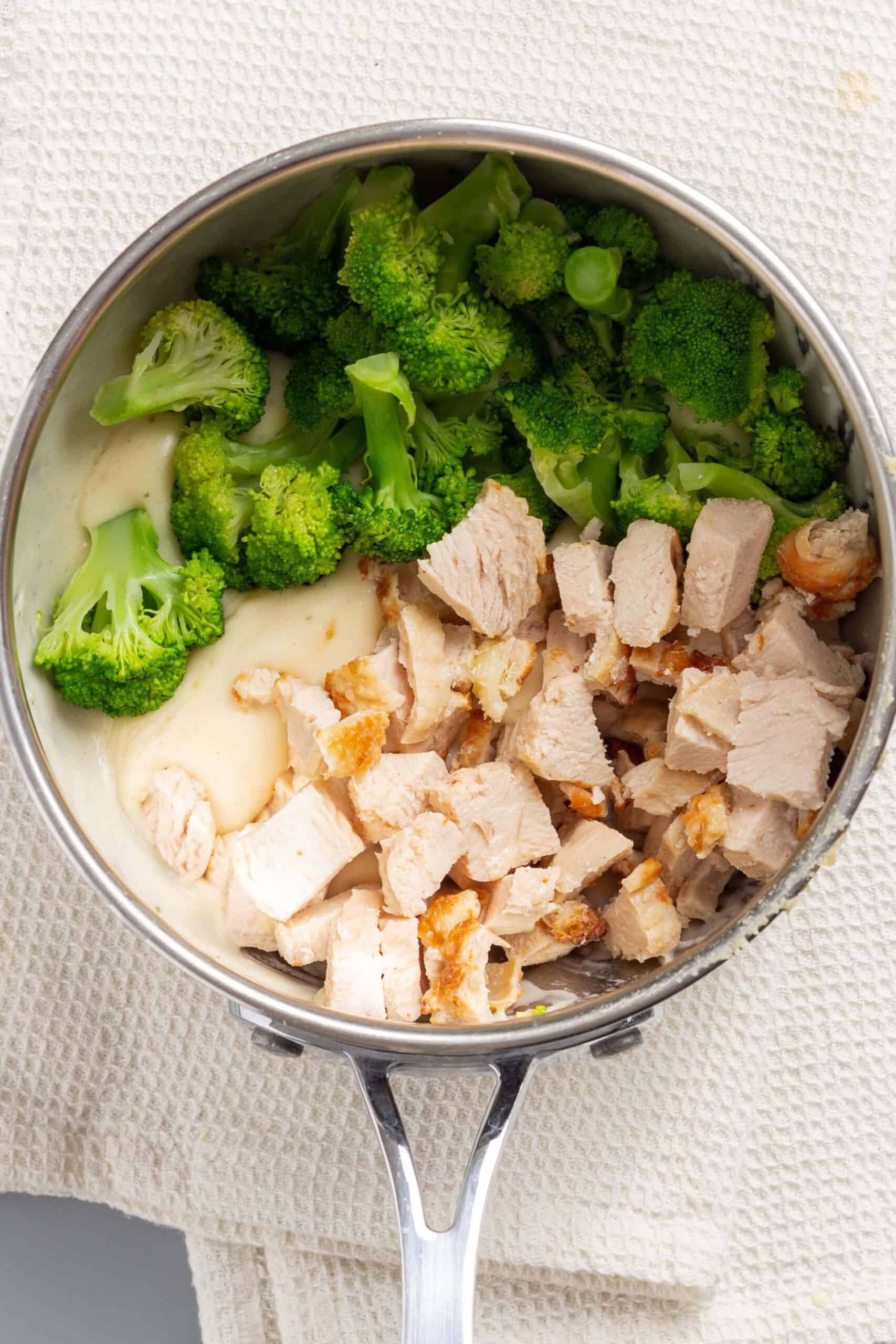 Broccoli and chicken added to sauce mixture.