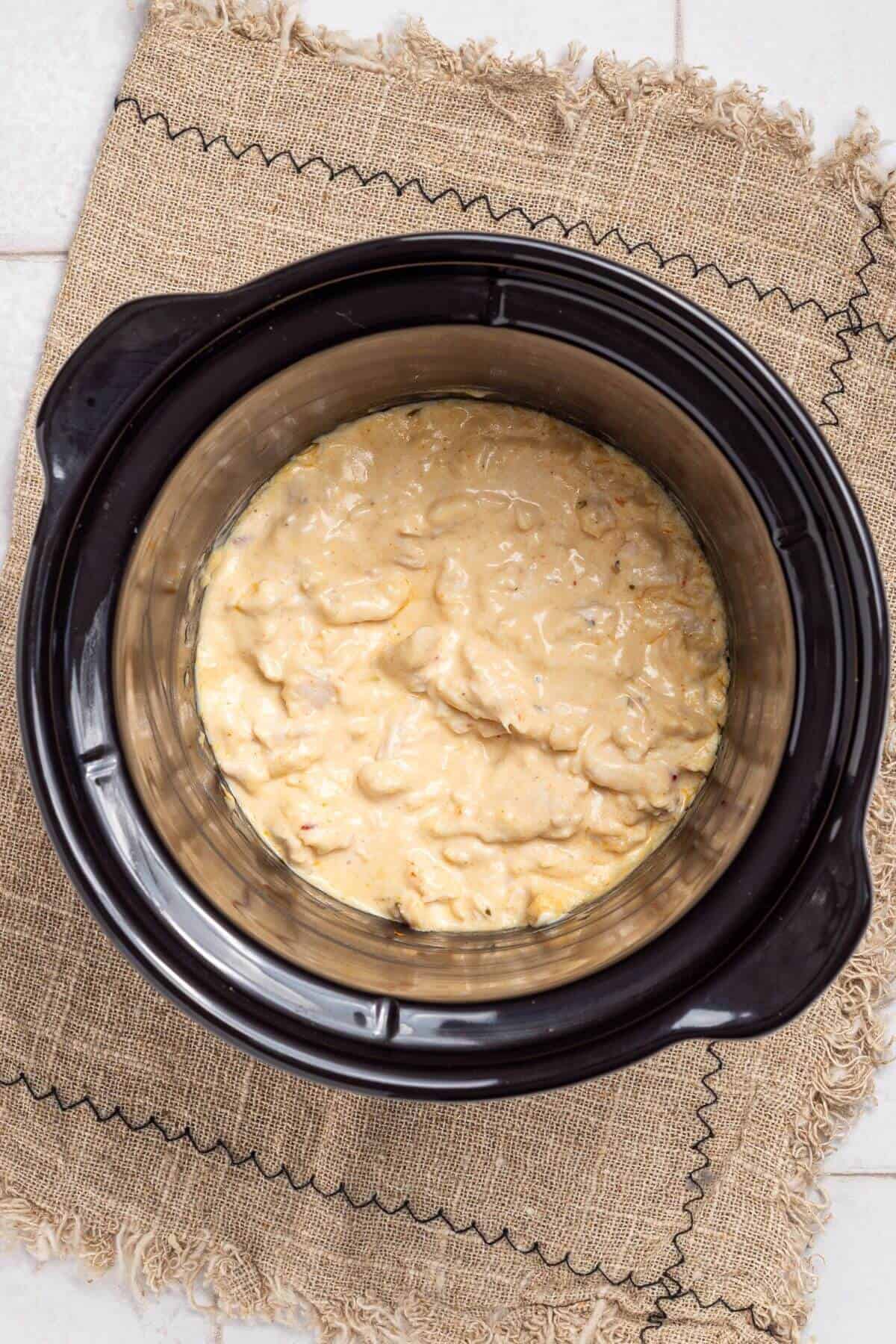 Slow cooked buffalo chicken dip in crock pot.