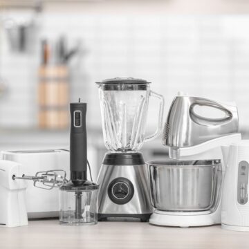 A small group of kitchen appliances on a table.
