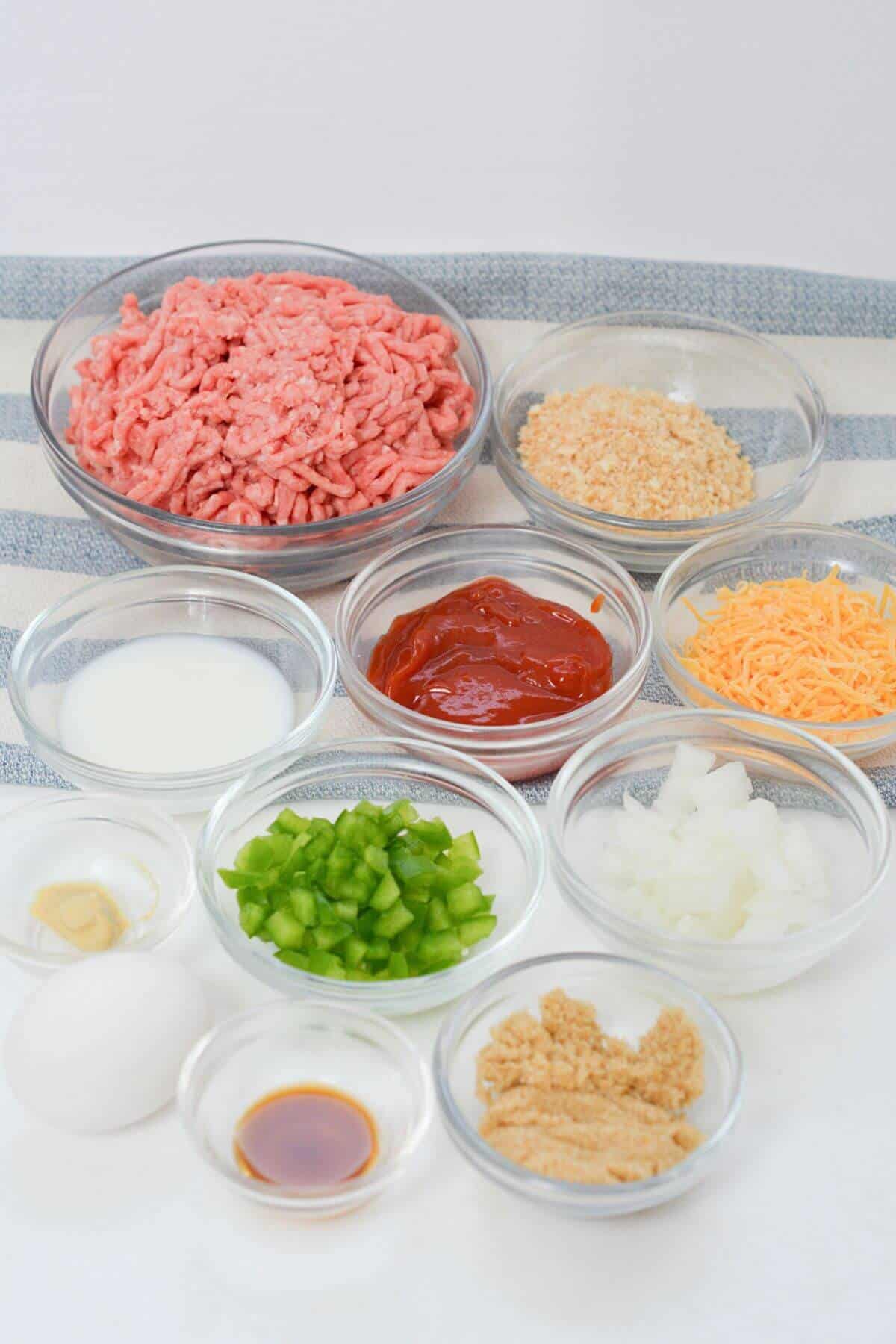 Ingredients for copycat Cracker Barrel Meatloaf in bowls on a table.
