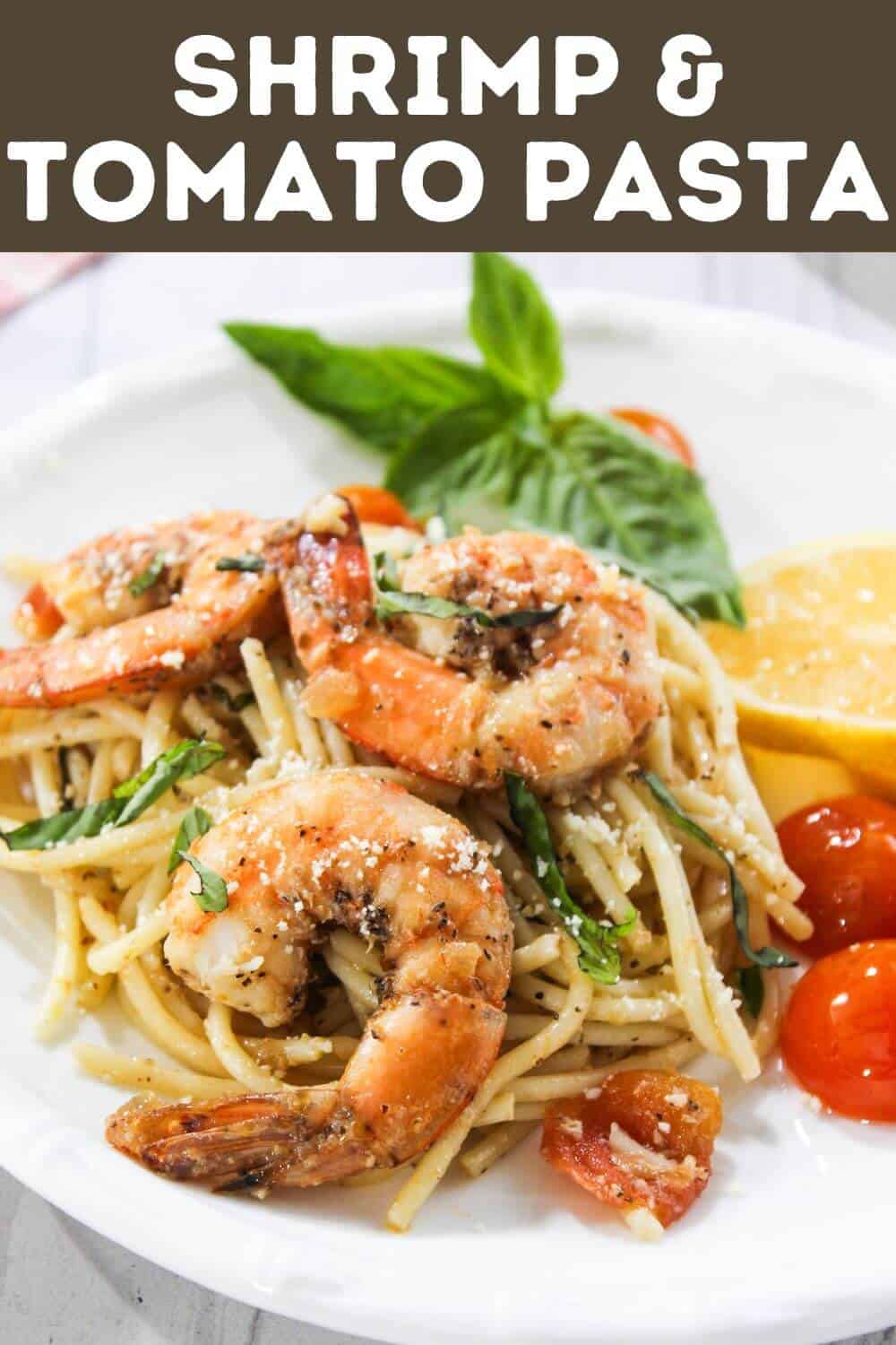 Shrimp and tomato pasta on a plate.