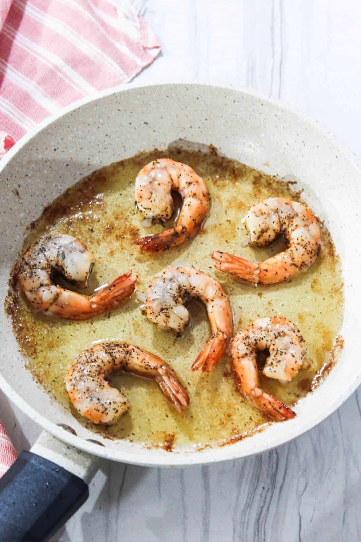 Fried shrimp in a frying pan.