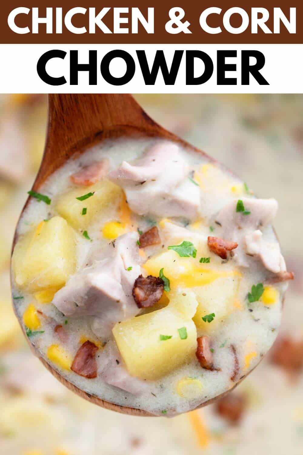 Chicken and corn chowder on a wooden spoon.