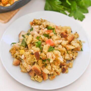Chicken and stuffing casserole on a white plate.