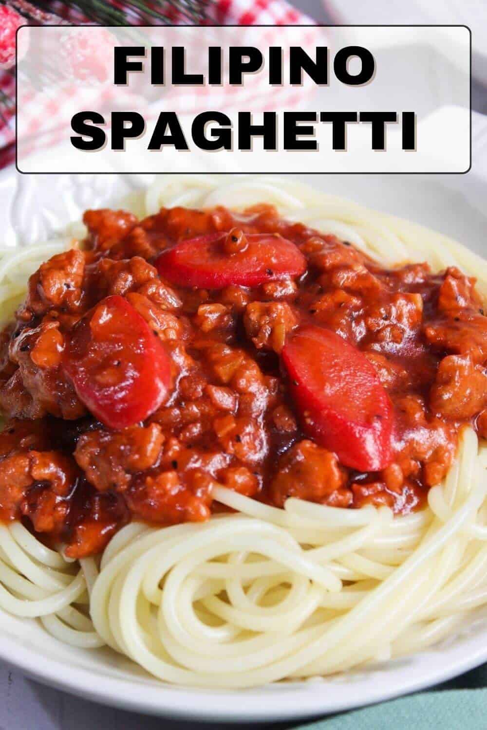 Filipino spaghetti with meat and tomatoes on a plate.