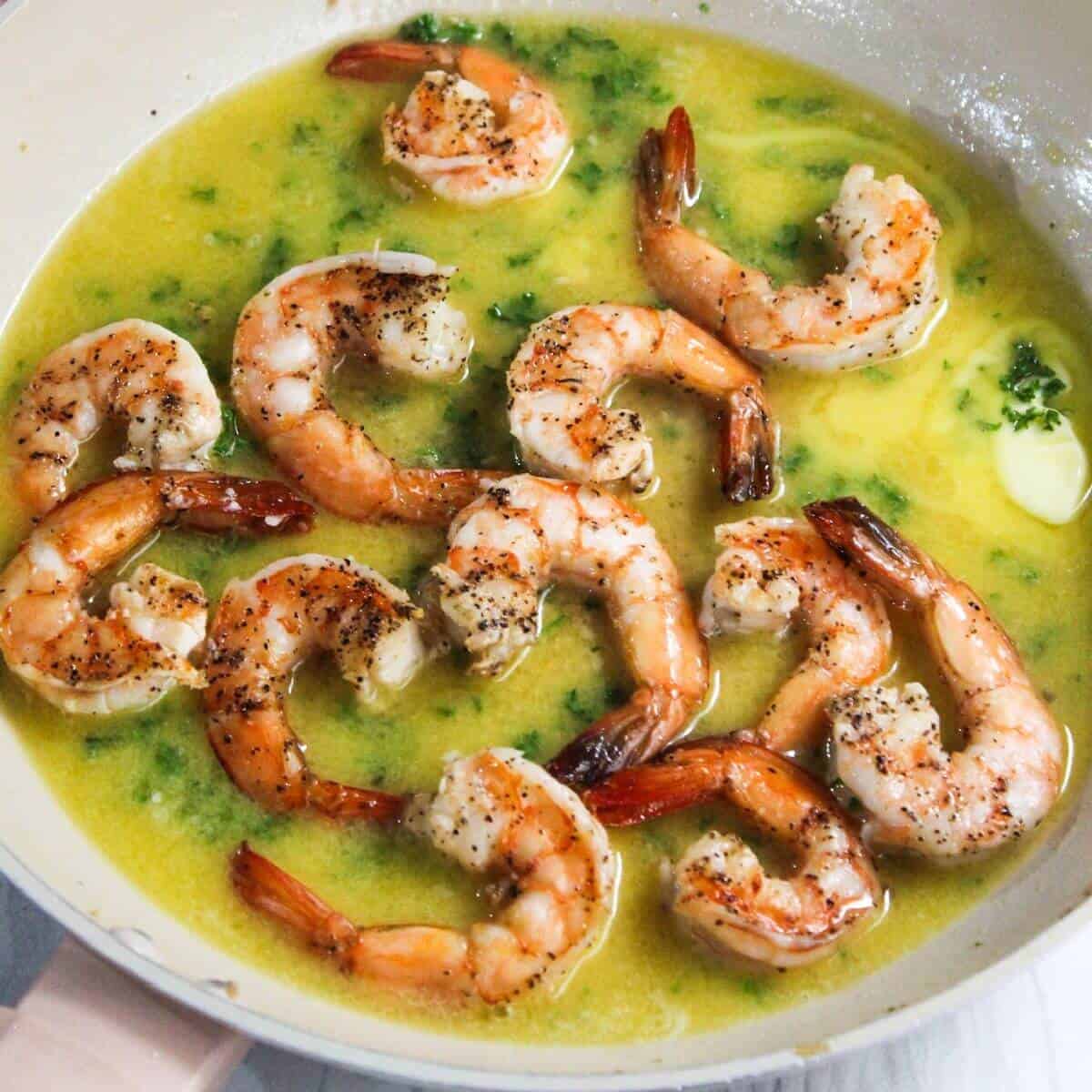Shrimp scampi in a skillet pan.