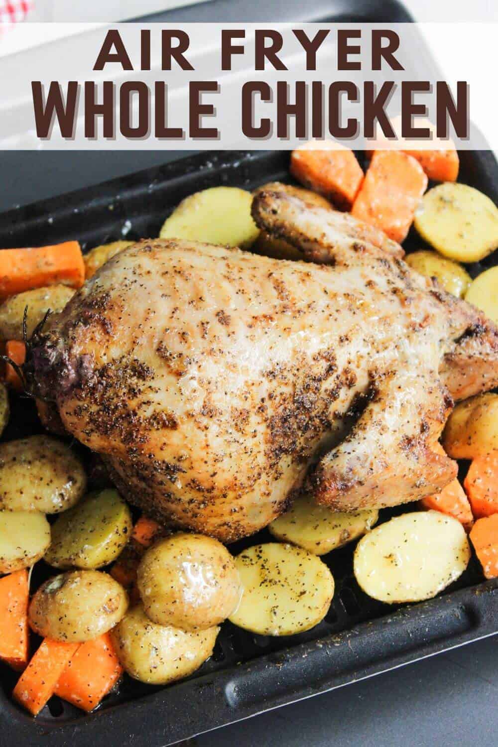 Air fryer whole chicken with carrots and potatoes.