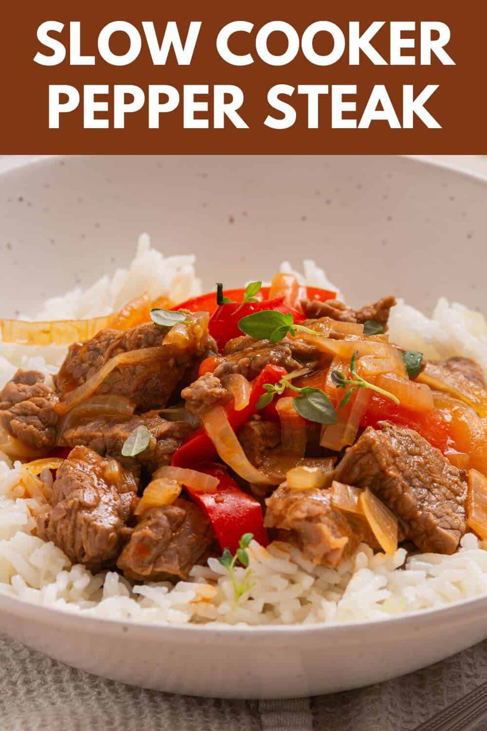 Slow cooker pepper steak with rice and peppers.