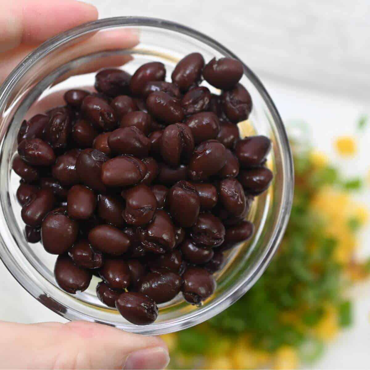 Black beans in a glass bowl.