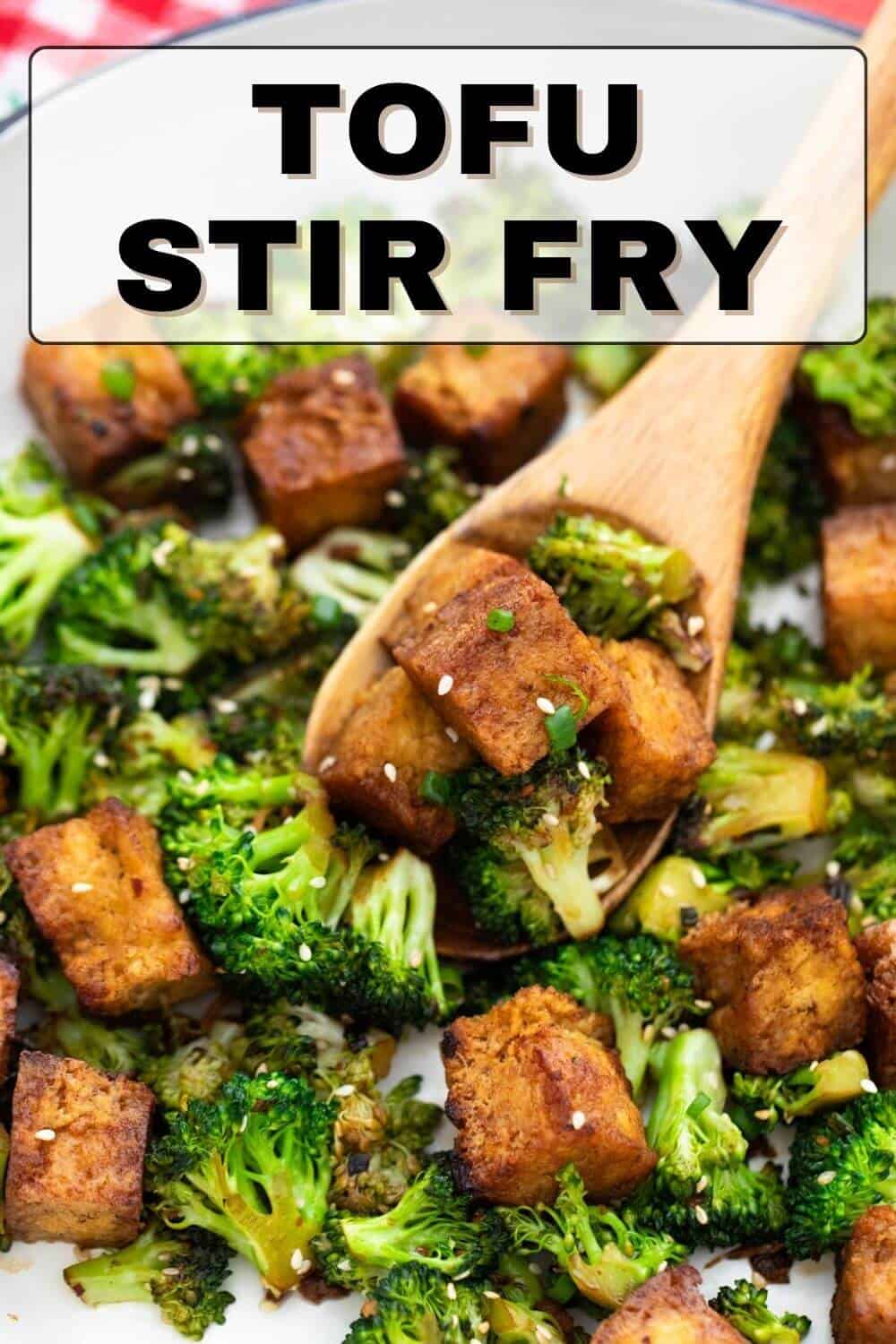 Tofu stir fry with broccoli on a plate.