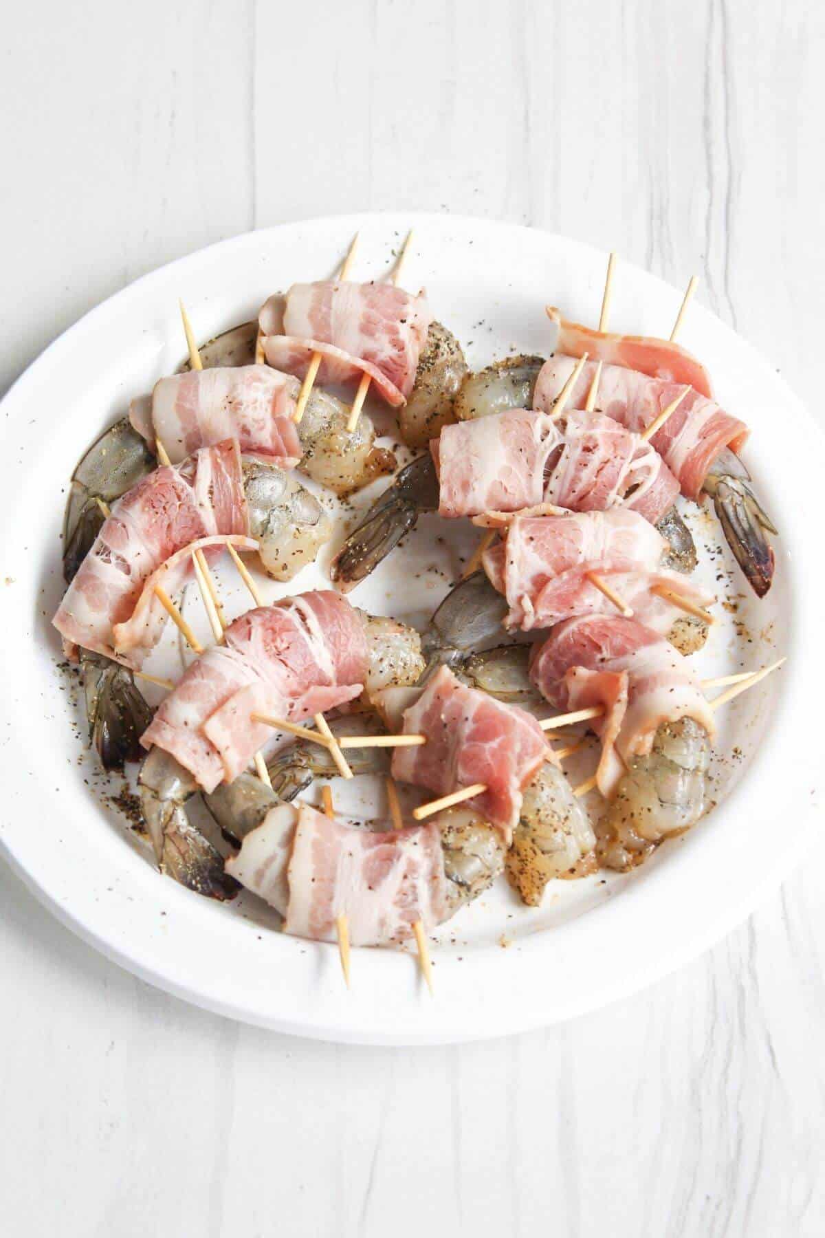 Bacon wrapped shrimp secured with toothpicks.