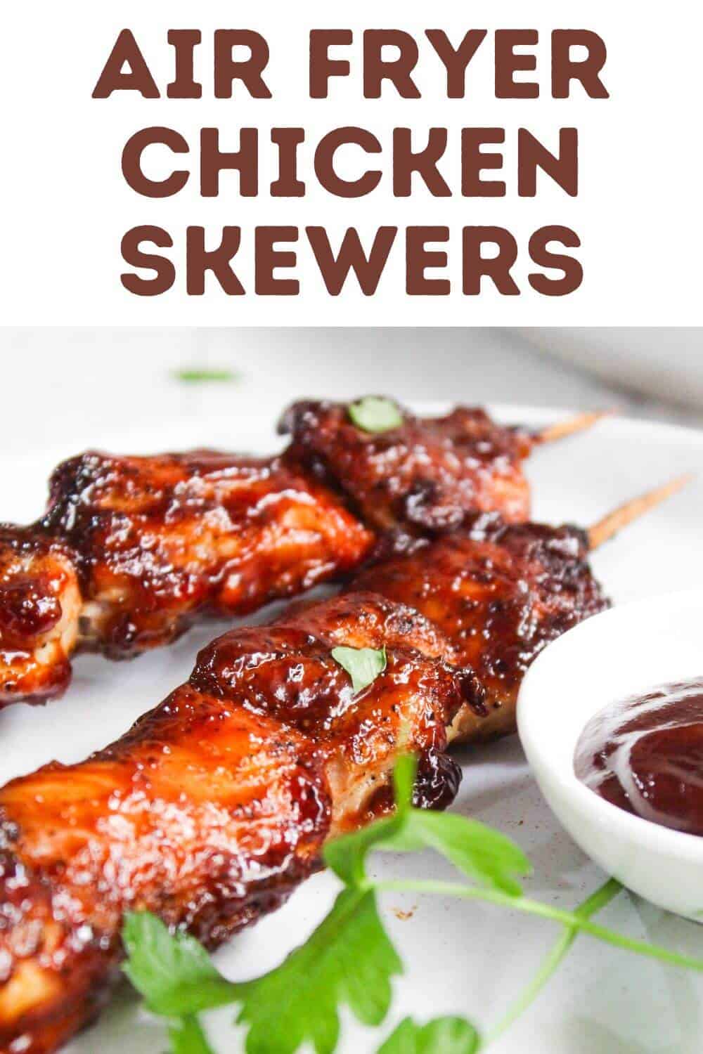 Chicken skewers on a plate.