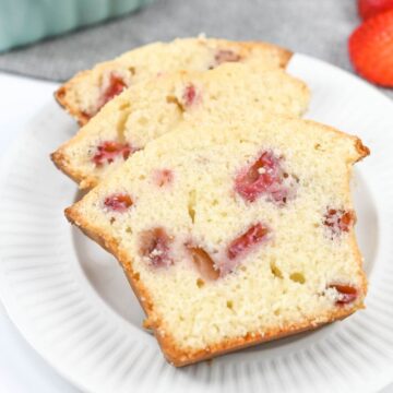 A close up of a mouthwatering strawberry pound cake slices.