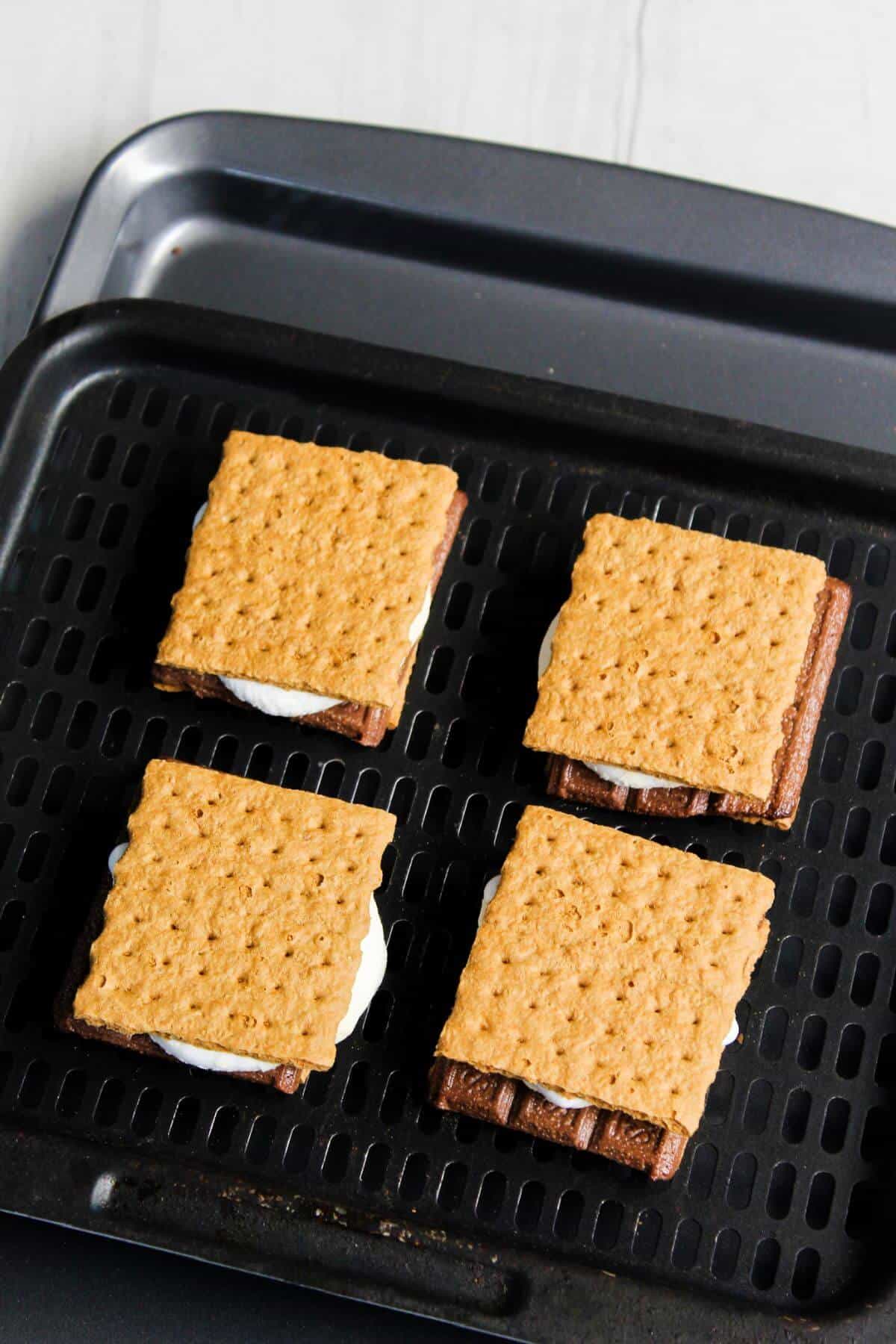 Graham cracker s'mores on air fryer tray.
