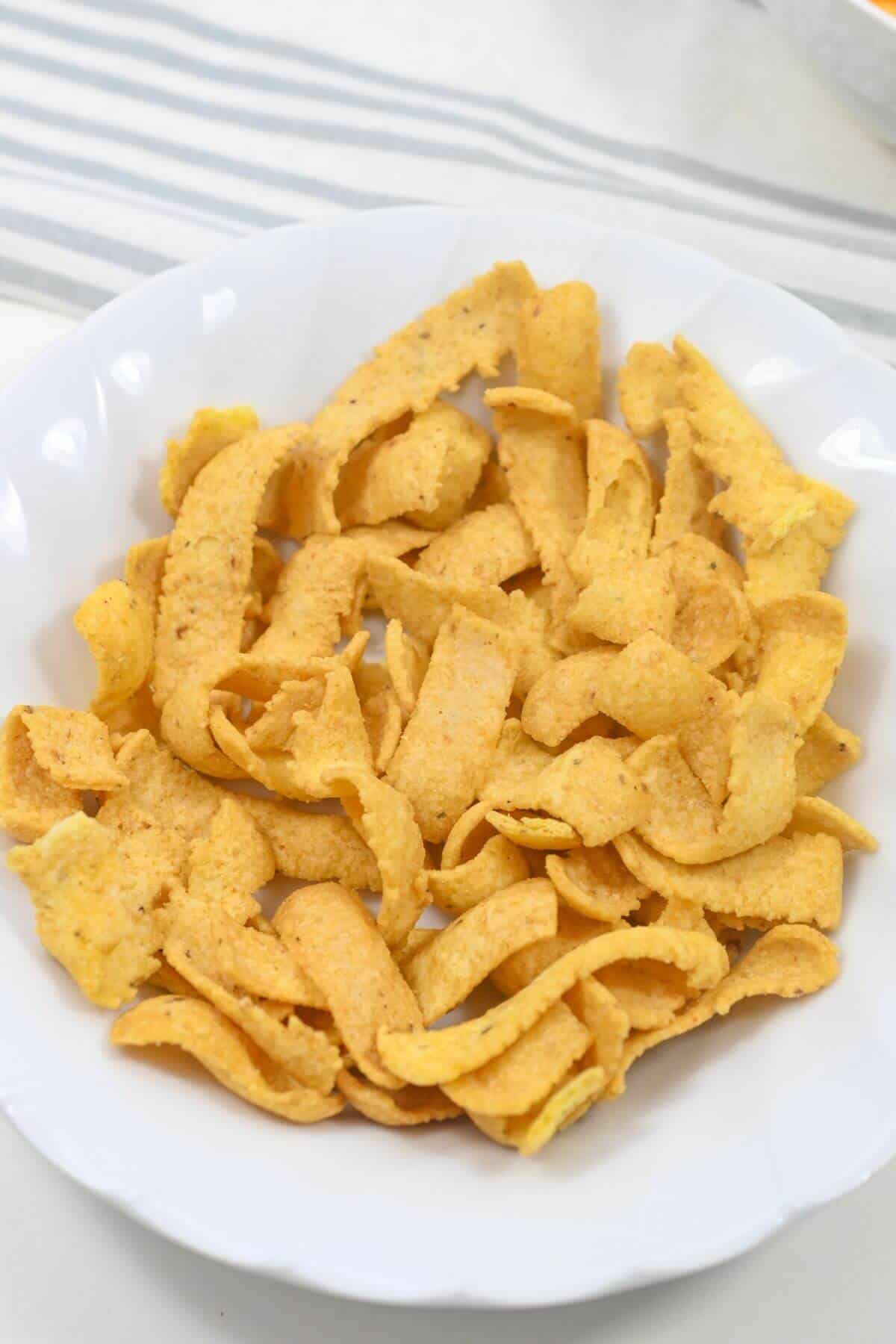 A bowl of Frito corn chips.