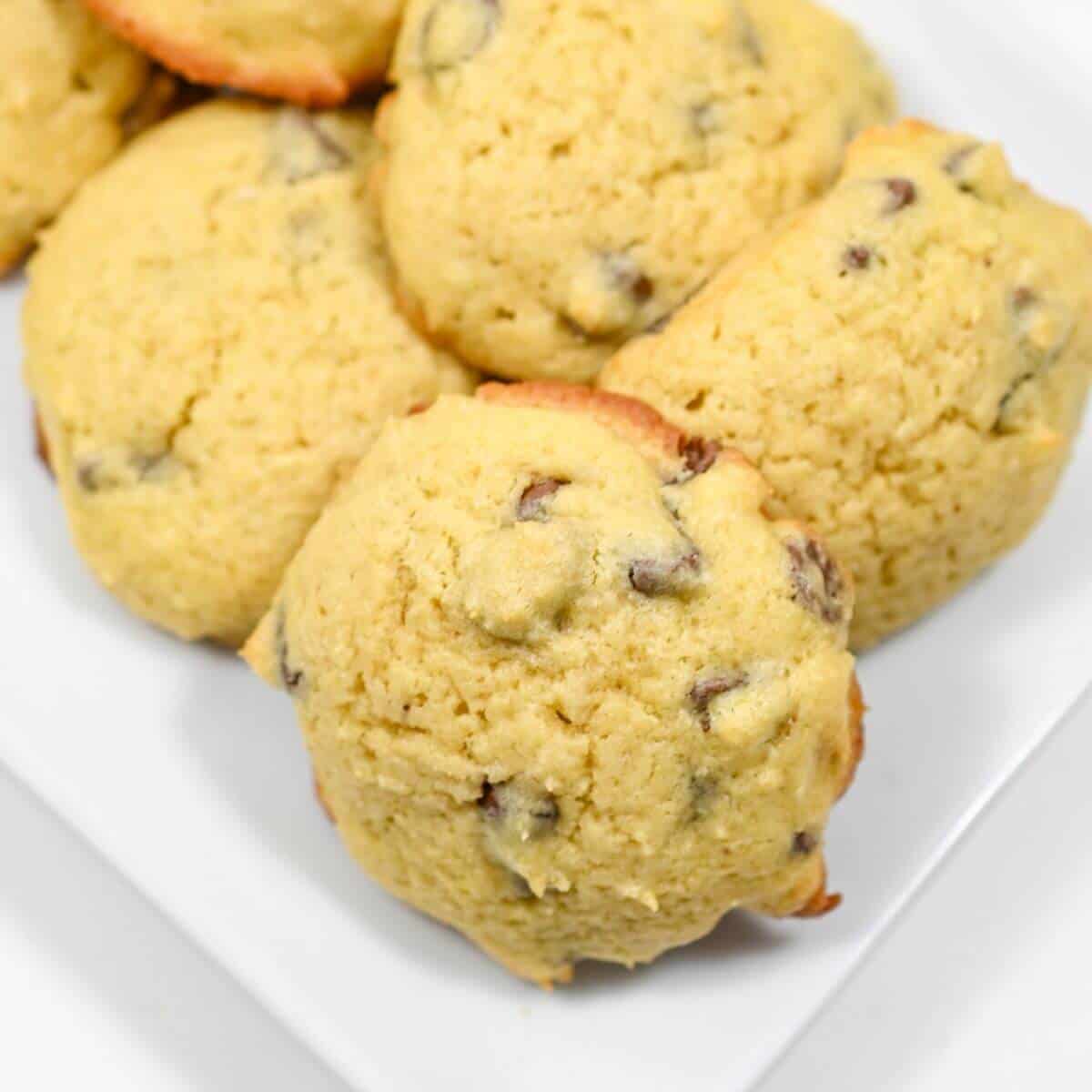 Chocolate chip cookies on a white plate.