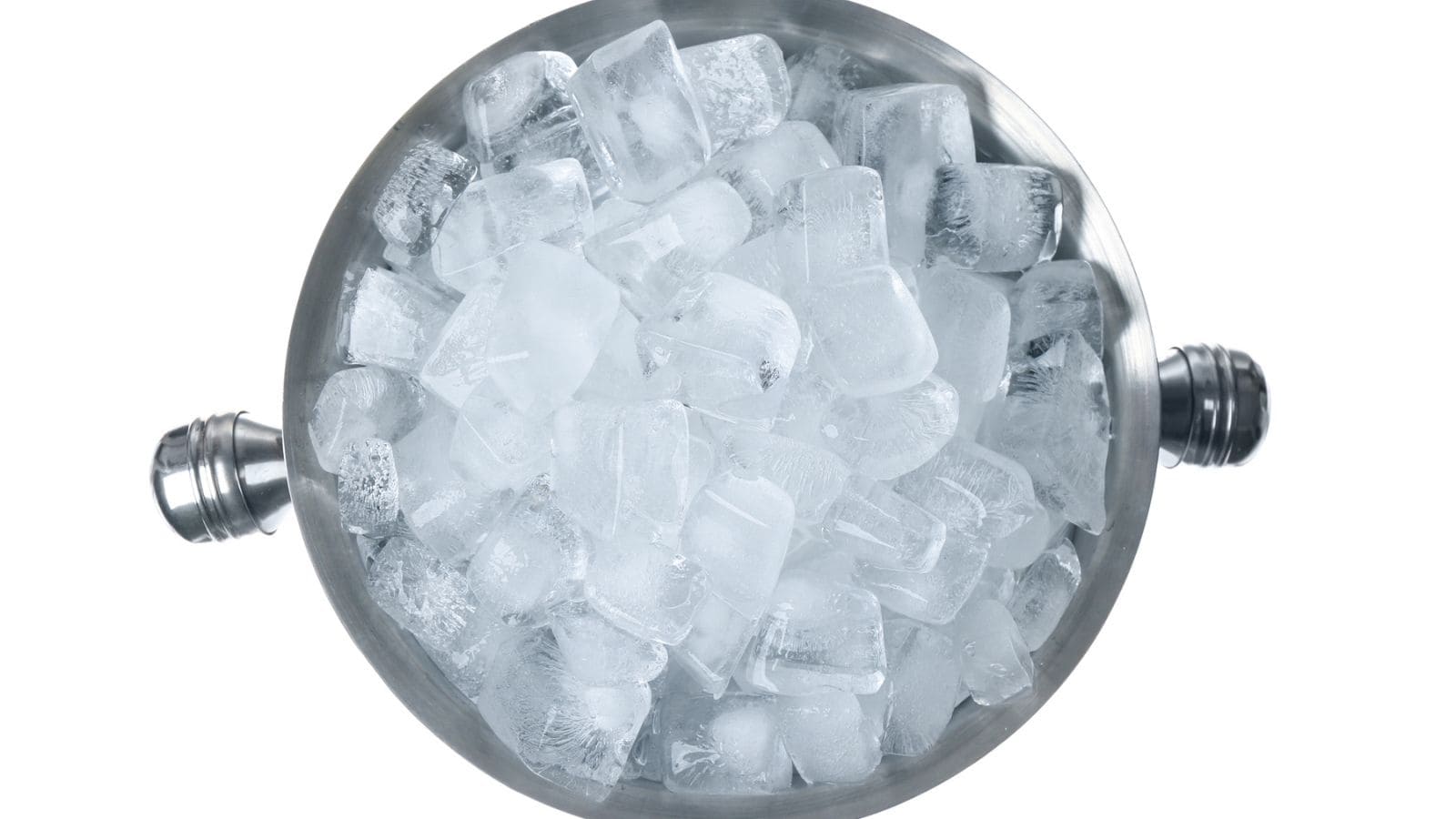 A metal ice bucket filled with ice cubes, viewed from above.