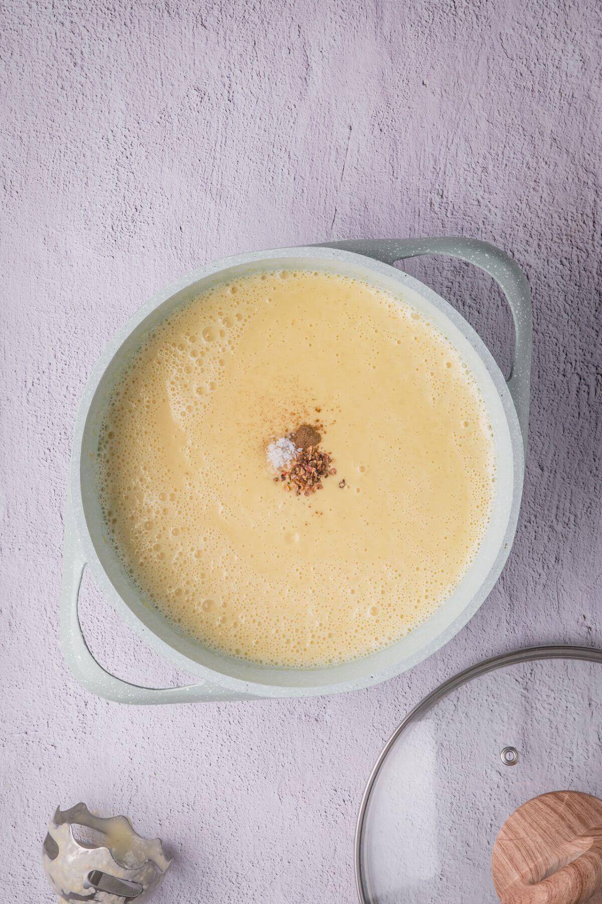 Blended yellow squash soup with salt and black pepper