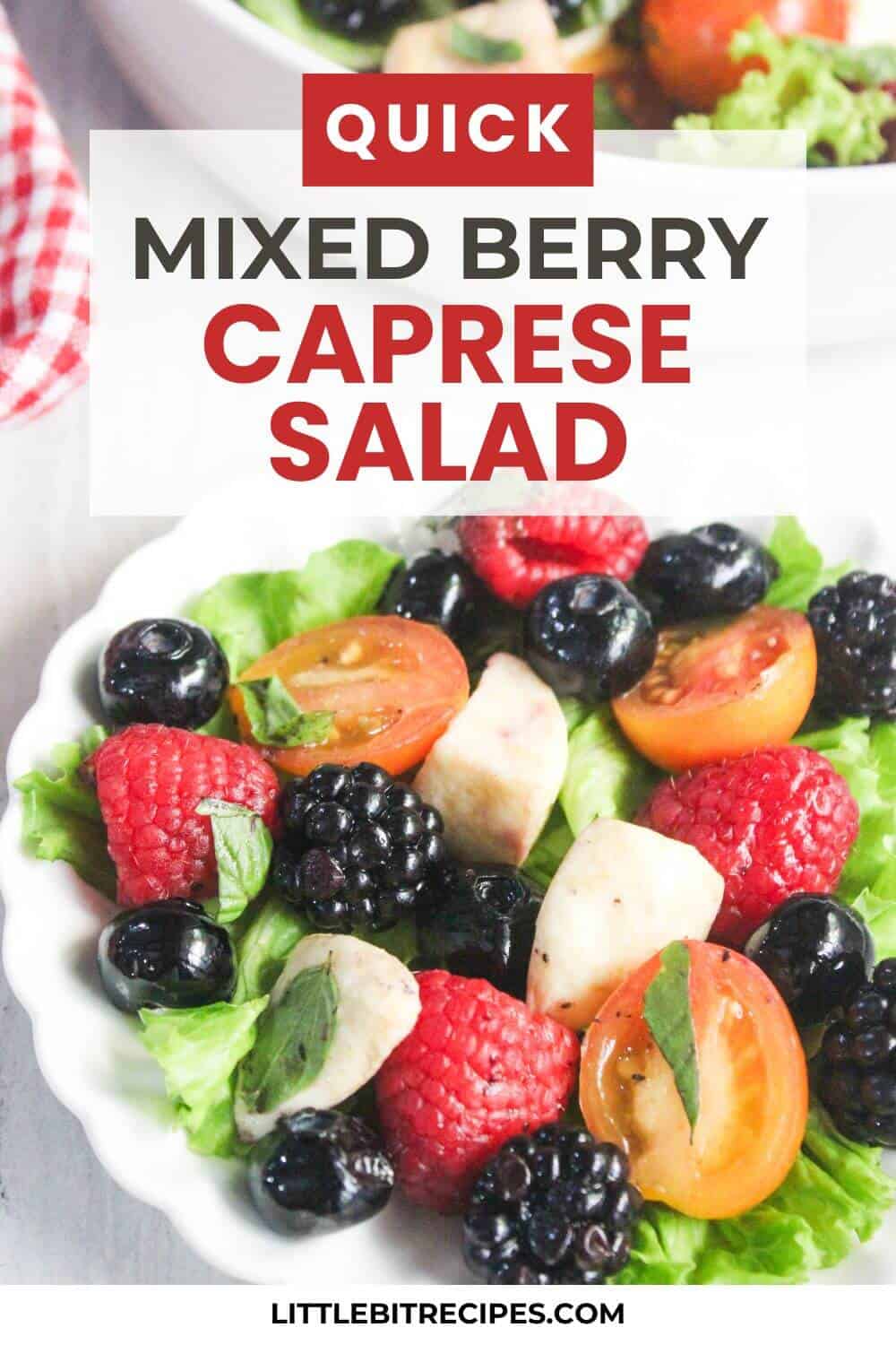 Mixed berry caprese salad with cherry tomatoes, blackberries, raspberries, blueberries, mozzarella, and basil in a white bowl. Text overlay describes the dish and website URL is visible.